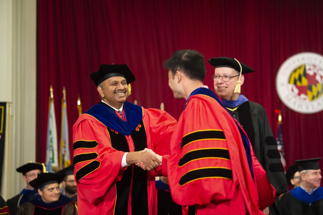 Dean Amitabh Varshney shakes graduate's hand on stage